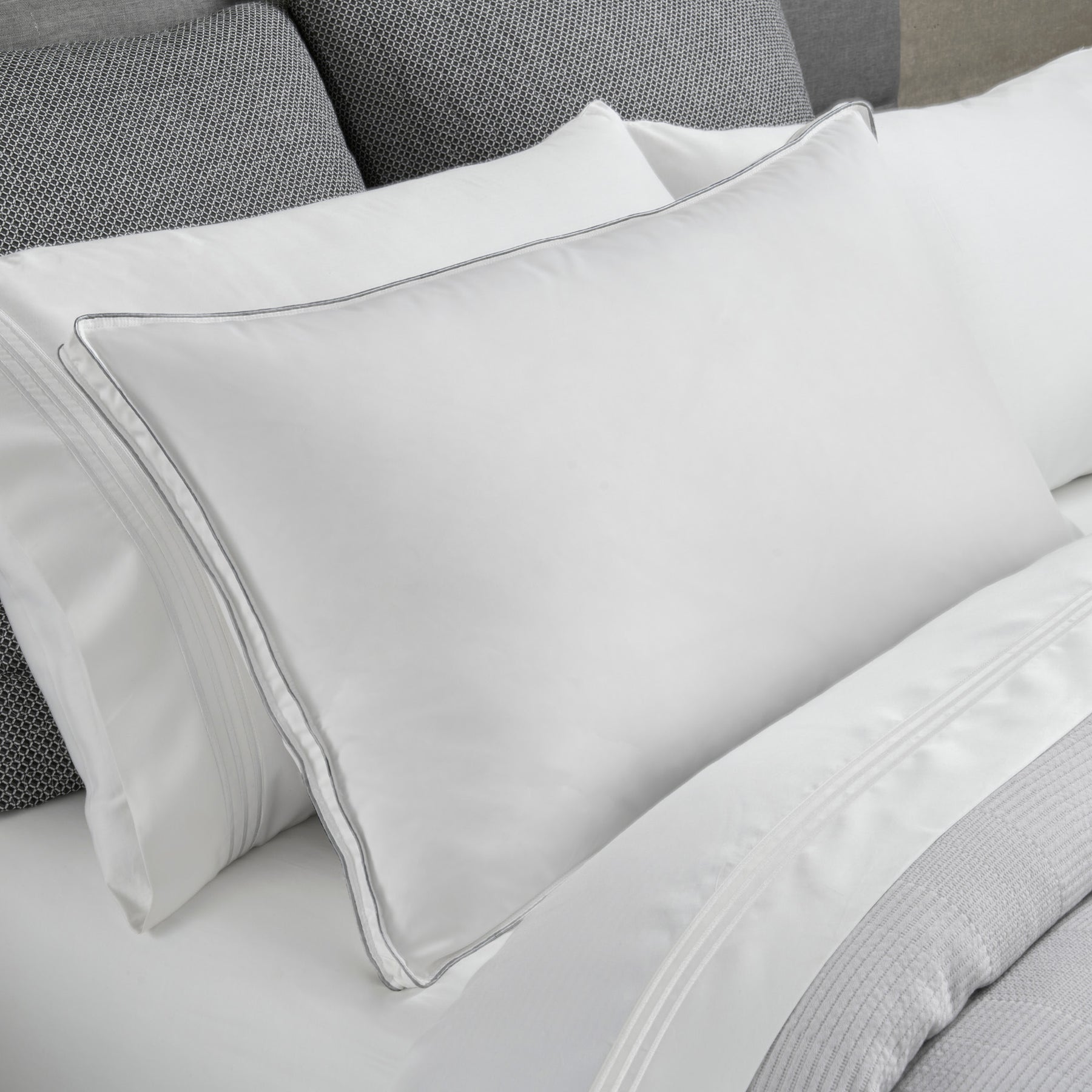 Image of a Cooling Fiber Pillow on a gray and white bed