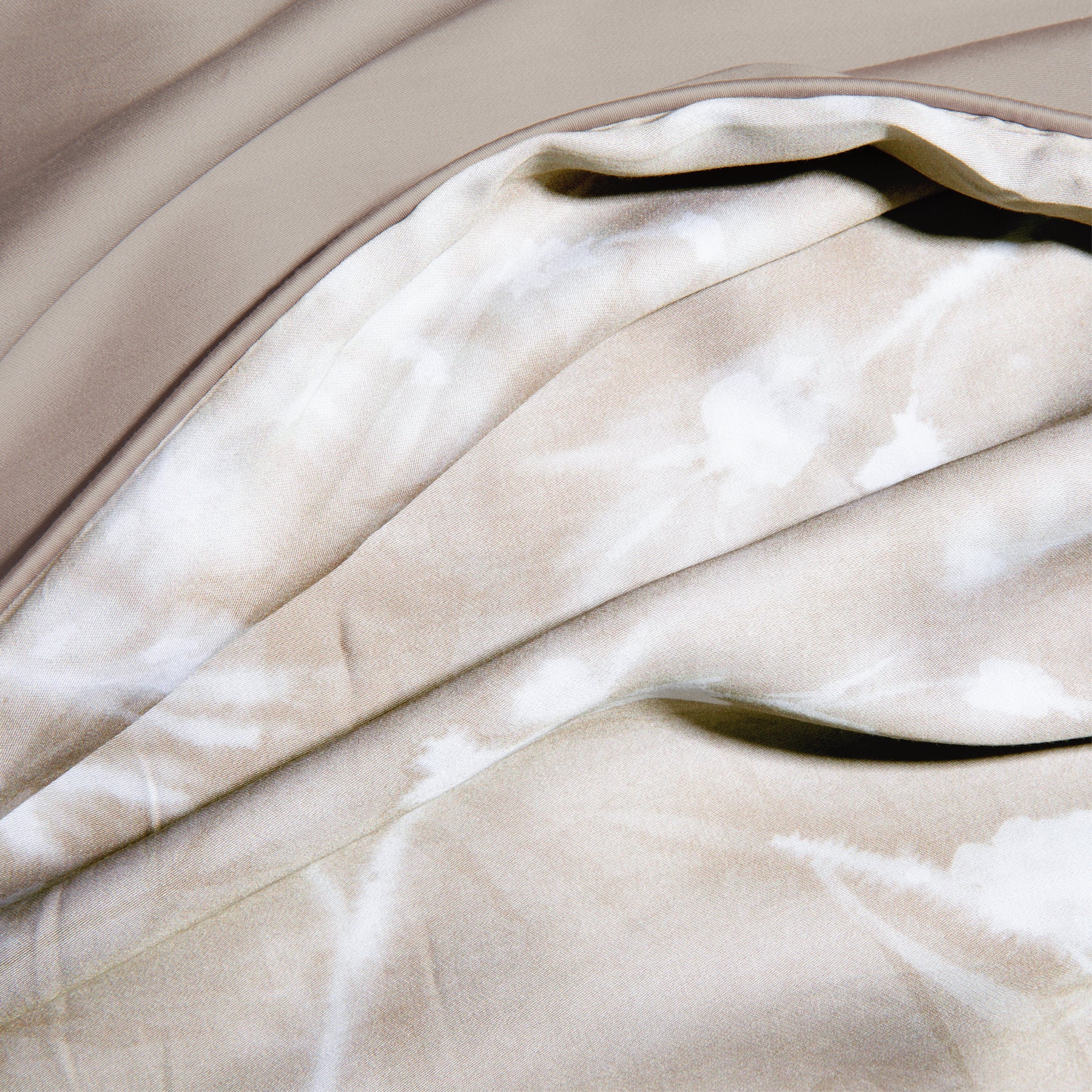 Close-up image of the Floral Oatmeal Pillow Shams + Cooling showcasing both the Floral Oatmeal side and the reversible plain Oatmeal side